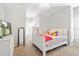 Bright bedroom with natural light features white furniture and neutral carpet at 4094 Oak St, Orlando, FL 32814