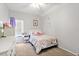 Bright bedroom with natural light features white furniture and neutral carpet at 4094 Oak St, Orlando, FL 32814