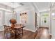 Elegant dining room with hardwood floors, stylish light fixture, and ample seating at 4094 Oak St, Orlando, FL 32814