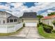 Detached garage with a clean, white door and well-kept landscaping at 4094 Oak St, Orlando, FL 32814
