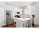 Modern kitchen featuring stainless steel appliances and a center island with seating at 4094 Oak St, Orlando, FL 32814