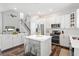 Open white kitchen featuring stainless steel appliances, subway tile and kitchen island at 4094 Oak St, Orlando, FL 32814