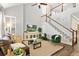 Spacious living room with two-story ceilings, lots of light and staircase at 4094 Oak St, Orlando, FL 32814