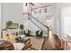 Spacious living room with two-story ceilings, lots of light, and staircase at 4094 Oak St, Orlando, FL 32814