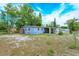 View of the home's backyard and covered patio at 411 Hibiscus Rd, Casselberry, FL 32707