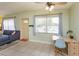 Living room featuring a comfortable sectional sofa, a dining table and tile floors and lots of natural light at 411 Hibiscus Rd, Casselberry, FL 32707