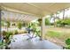 Cozy covered patio with plants, a hammock, and room for relaxing at 411 Hibiscus Rd, Casselberry, FL 32707