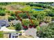 Drone view displaying the property within a community of homes among mature trees at 485 Sandpiper Ridge Dr, Orlando, FL 32835