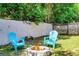 Charming backyard with a fire pit and Adirondack chairs, great for cozy evenings outdoors at 485 Sandpiper Ridge Dr, Orlando, FL 32835