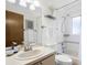 Bright bathroom featuring a bathtub-shower combo and white tiling at 485 Sandpiper Ridge Dr, Orlando, FL 32835
