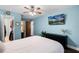 Bedroom features a ceiling fan, TV and access to walk-in closet and ensuite bathroom at 485 Sandpiper Ridge Dr, Orlando, FL 32835