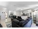 Spacious living area featuring a comfortable sectional sofa, modern decor, and an open layout to the dining area at 485 Sandpiper Ridge Dr, Orlando, FL 32835