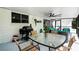 Patio with seating and dining area; includes grill and view of the backyard at 485 Sandpiper Ridge Dr, Orlando, FL 32835