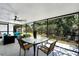 Relaxing screened patio with ceiling fan and outdoor furniture, ideal for enjoying the backyard view at 485 Sandpiper Ridge Dr, Orlando, FL 32835