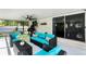 Stylish screened patio with comfortable seating and a grill, perfect for outdoor entertaining at 485 Sandpiper Ridge Dr, Orlando, FL 32835
