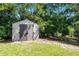Convenient storage shed in the backyard, providing ample space for tools and equipment at 485 Sandpiper Ridge Dr, Orlando, FL 32835