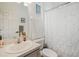 Clean bathroom featuring a vanity with countertop space, decorative accents, and a shower with a curtain at 506 Pineloch Dr, Haines City, FL 33844