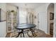 Well-lit dining room featuring modern lighting, a large window, and ample seating at 506 Pineloch Dr, Haines City, FL 33844