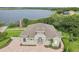 Stately home with lush landscaping and brick driveway, located near the water at 506 Pineloch Dr, Haines City, FL 33844