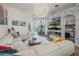 Bright living room with fireplace, large sectional, and access to the outdoor pool area at 506 Pineloch Dr, Haines City, FL 33844