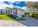 A single Gathering home with a paved drive and lush landscaping at 516 Sanctuary Golf Pl, Apopka, FL 32712