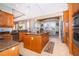 Kitchen featuring a kitchen island, stainless appliances, and a breakfast nook with large windows at 516 Sanctuary Golf Pl, Apopka, FL 32712