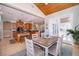 Open concept kitchen and breakfast nook with stainless appliances, tile floor, and abundant natural light at 516 Sanctuary Golf Pl, Apopka, FL 32712