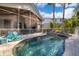 Backyard pool and spa area featuring lounge chairs, and screened-in porch at 516 Sanctuary Golf Pl, Apopka, FL 32712