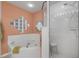 Bathroom featuring a glass-enclosed shower and a whirlpool tub at 5300 S Atlantic Ave # 2-501, New Smyrna Beach, FL 32169