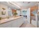 Large bathroom with double sinks, walk-in shower, soaking tub and decorative glass block at 5300 S Atlantic Ave # 2-501, New Smyrna Beach, FL 32169