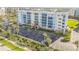 Beautiful multi-story condo with blue balconies and lush tropical landscaping at 5300 S Atlantic Ave # 2-501, New Smyrna Beach, FL 32169