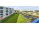 Well-maintained lawn and a glimpse of the condo from the balcony at 5300 S Atlantic Ave # 2-501, New Smyrna Beach, FL 32169
