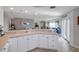 Spacious kitchen featuring white cabinets and an open layout at 5300 S Atlantic Ave # 2-501, New Smyrna Beach, FL 32169