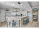 Bright kitchen with white cabinets, modern appliances, and bar seating at 5300 S Atlantic Ave # 2-501, New Smyrna Beach, FL 32169