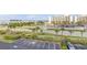 View of the parking lot and nearby buildings from the balcony at 5300 S Atlantic Ave # 2-501, New Smyrna Beach, FL 32169
