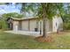 The home's garage features multiple bays, providing significant parking and storage at 5340 Jones Rd, St Cloud, FL 34771