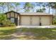 Attached 2-car garage offers ample space and blends with the property's aesthetic at 5340 Jones Rd, St Cloud, FL 34771