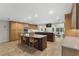 Spacious kitchen with an expansive island, custom cabinets, and modern appliances at 5340 Jones Rd, St Cloud, FL 34771