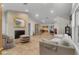 Open-concept living room featuring a fireplace, tile floors and natural light at 5340 Jones Rd, St Cloud, FL 34771