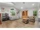 Living room showcasing ample lighting, tile floors, and neutral paint at 5340 Jones Rd, St Cloud, FL 34771