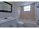 A classic bathroom with a sink, toilet, and tub with a shower, perfect for relaxing at 576 Fairways Ln # M103, Ocala, FL 34472