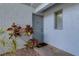 Ground floor entrance with colorful landscaping and a window for natural light at 576 Fairways Ln # M103, Ocala, FL 34472