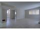 Spacious living area with tile floors and access to an adjacent bathroom at 576 Fairways Ln # M103, Ocala, FL 34472
