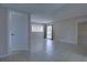 Bright and airy living room featuring tile flooring, large windows, and slider with curtains at 576 Fairways Ln # M103, Ocala, FL 34472