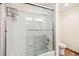 Modern bathroom with glass shower doors and tub at 600 Brechin Dr, Winter Park, FL 32792