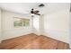 Bedroom with hardwood floors, neutral paint, window, and ceiling fan at 600 Brechin Dr, Winter Park, FL 32792