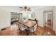 Cozy dining room with hardwood floors, a modern chandelier, and ample natural light, ideal for Gathering gatherings at 600 Brechin Dr, Winter Park, FL 32792
