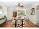Charming dining room featuring hardwood floors, a modern chandelier, and an open layout, perfect for entertaining guests at 600 Brechin Dr, Winter Park, FL 32792