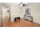 Hallway with hardwood floors, a ceiling fan and a decorative console table at 600 Brechin Dr, Winter Park, FL 32792