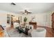 Comfortable living room featuring hardwood floors, a ceiling fan, a neutral color palette, and an open layout at 600 Brechin Dr, Winter Park, FL 32792